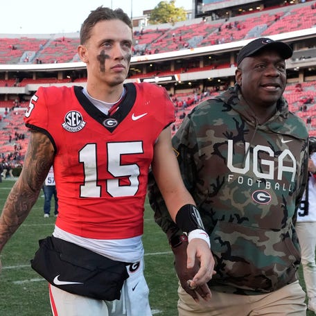 Georgia quarterback Carson Beck (15) leaves the field after a NCAA college football game against Massachusetts in Athens, Ga., on Saturday, Nov. 23, 2024. Georgia won 59-21.