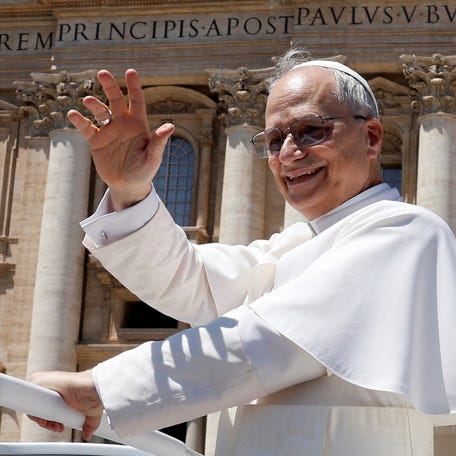 Pope Leo XIV waves as he leaves on board of the popemobile, after a general audience in St. Peter's Square at the Vatican, May 28, 2025. REUTERS/Remo Casilli REFILE - QUALITY REPEAT