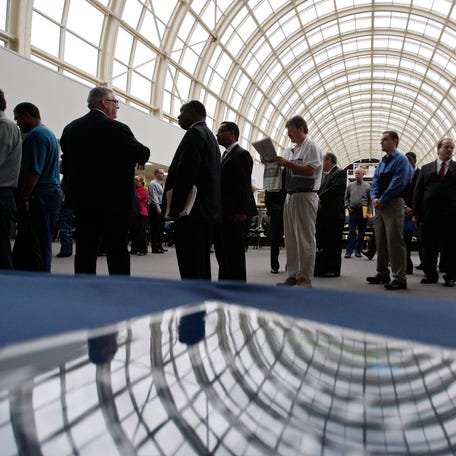 Job seekers queue as they wait for a career fair to open in Dallas, Texas.