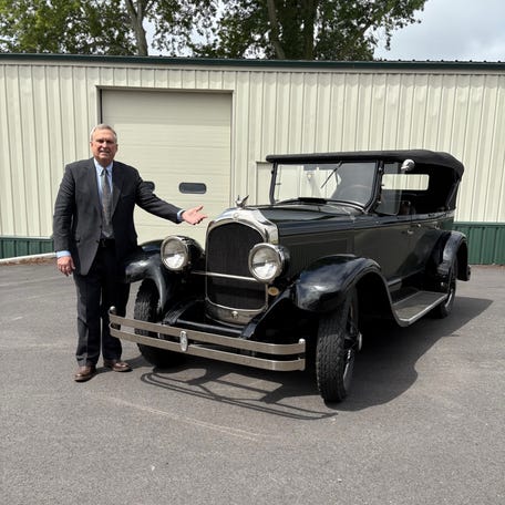 Frank Rhodes, great-grandson of Walter P. Chrysler, poses with his 1926 Chrysler Imperial E-80.