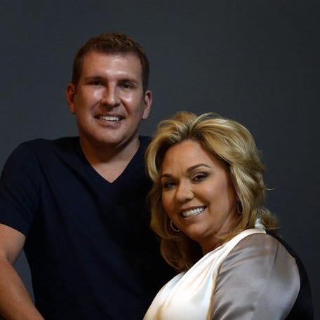 Reality TV stars Todd Chrisley and Julie Chrisley pose for a photo at their Belle Meade home on June 12, 2018.