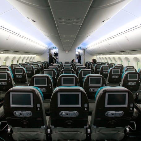 A picture shows the economy cabin of an airplane.