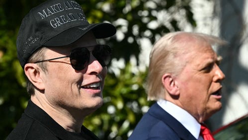 President Donald Trump and Tesla CEO Elon Musk speak to the press as they stand next to a Tesla vehicle on the South Portico of the White House on March 11, 2025 in Washington, DC
