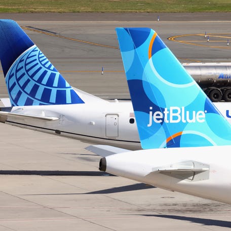 Airplanes from United and JetBlue populate the taxiway at LaGuardia Airport on November 10, 2022 in the Queens borough of New York City. (Photo by Bruce Bennett/Getty Images)