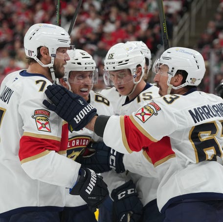 Game 5: Florida Panthers defensemen Niko Mikkola (77) and Nate Schmidt (88) celebrate a goal by forward Anton Lundell (15) on an assist from forward Brad Marchand (63) during the second period against the Carolina Hurricanes.