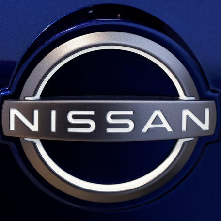 A logo of Nissan is seen inside a Nissan car dealer in Arnhem, Netherlands February 18, 2025.