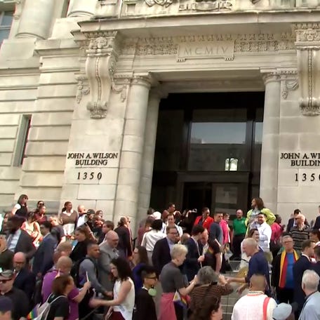 Officials, organizers and supporters gathered in front of the John A. Wilson building in Washington D.C. as the Pride flag was raised.