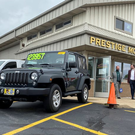 Alex Tovstanovsky, owner of used-car dealer Prestige Motor Works, checks on depleted inventory with his general manager Ryan Caton after sales jumped in May following two down months because of the coronavirus disease (COVID-19) pandemic in Naperville, Illinois, U.S. May 28, 2020.