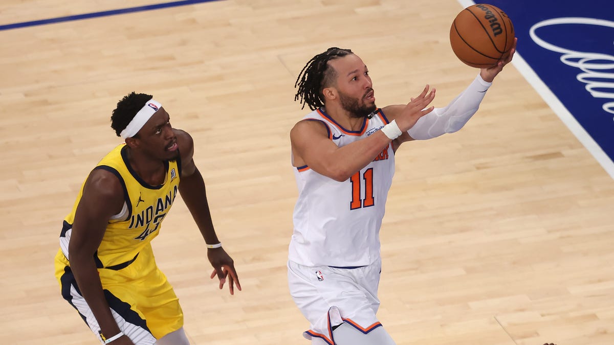 New York Knicks guard Jalen Brunson (11) shoots against Indiana Pacers forward Pascal Siakam (43) and forward Jarace Walker (5) during the second quarter of Game 5 at Madison Square Garden.
