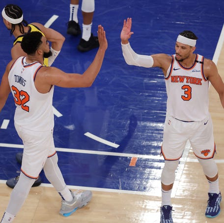 New York Knicks center Karl-Anthony Towns (32) and guard Josh Hart (3) react in the fourth quarter against the Indiana Pacers during game five of the eastern conference finals for the 2025 NBA Playoffs at Madison Square Garden.