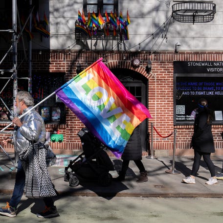 People protest against U.S. President Donald Trump's administration's move to restrict transgender rights at the Stonewall Inn and the Stonewall National Monument in New York City on Feb. 14, 2025.