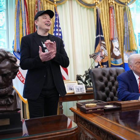 Tesla CEO Elon Musk claps as U.S. President Donald Trump speaks to reporters in the Oval Office of the White House on May 30, 2025 in Washington, DC. Musk, who served as an adviser to Trump and led the Department of Government Efficiency, announced he would leave the Trump administration early this week to refocus on his businesses.