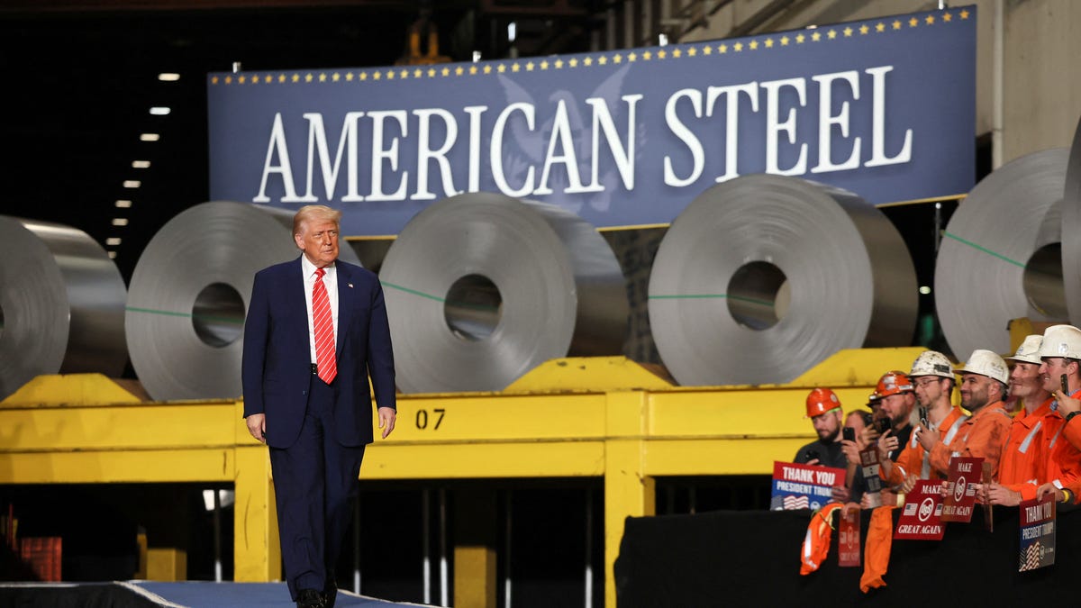 President Donald Trump walks as workers react at U.S. Steel Corporation–Irvin Works in West Mifflin, Pennsylvania, U.S., May 30, 2025.