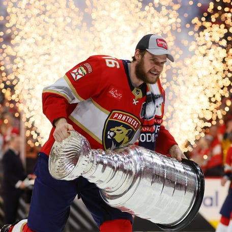 Florida Panthers captain Aleksander Barkov holds the Stanley Cup after defeating the Edmonton Oilers in last year's Stanley Cup Final.