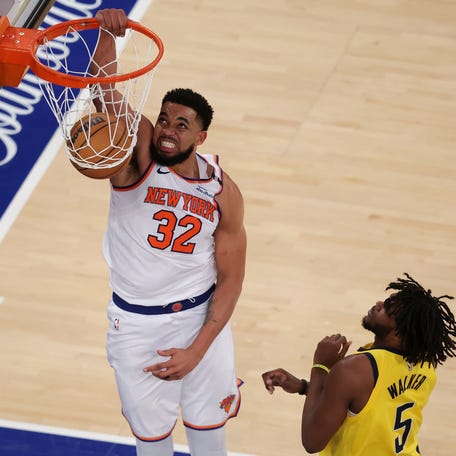 New York Knicks center Karl-Anthony Towns (32) dunks against Indiana Pacers forward Jarace Walker (5) in the fourth quarter during game five of the eastern conference finals for the 2025 NBA Playoffs at Madison Square Garden. Mandatory Credit: Brad Penner-Imagn Images