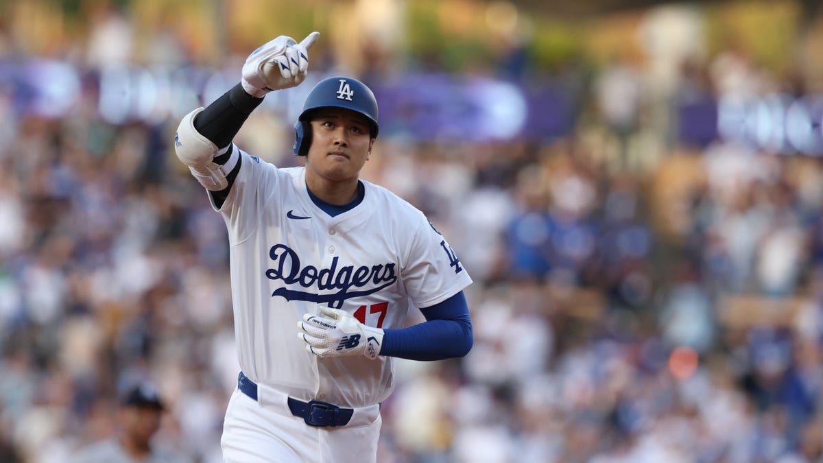 Dodgers' Shohei Ohtani rounds the bases after hitting a home run during the first inning against the Yankees.