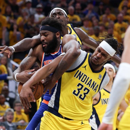 Game 6: The New York Knicks' Mitchell Robinson (23) battles for the ball against the Indiana Pacers' Pascal Siakam.