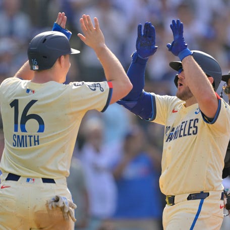 Max Muncy celebrates with Will Smith (16) after a three-run home run against the New York Yankees.