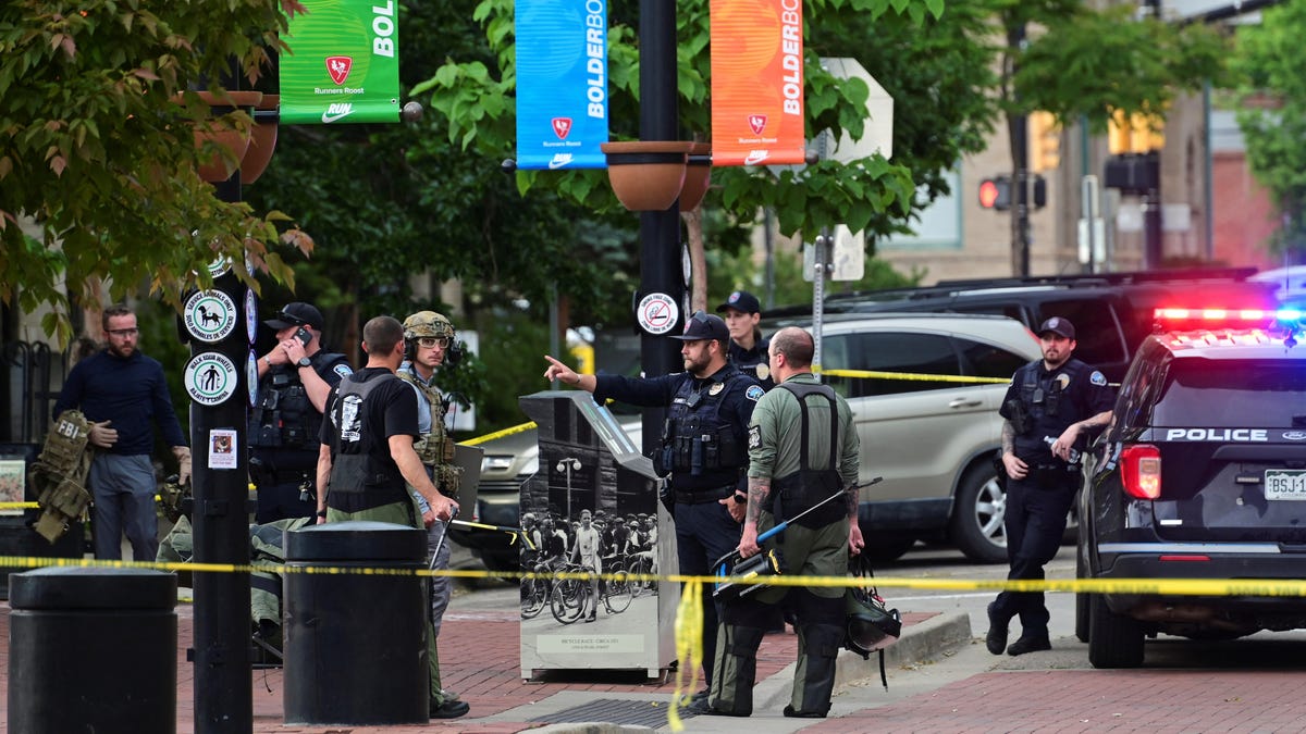 Police and FBI agents gather, after an attack that injured multiple people, in Boulder, Colorado on June 1, 2025.
