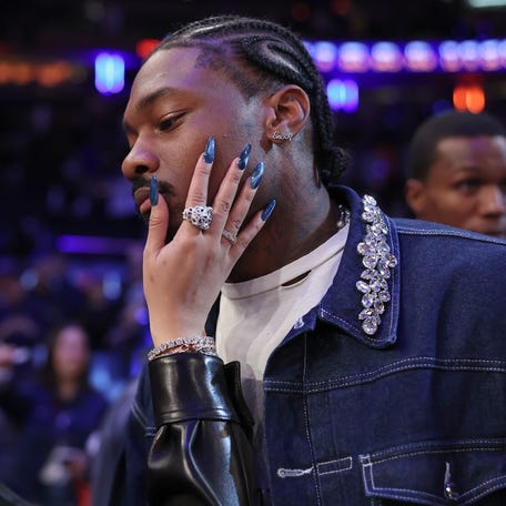 Stefon Diggs and Cardi B celebrate after Game 4 of the Eastern Conference Second Round NBA Playoffs between the Boston Celtics and the New York Knicks at Madison Square Garden on May 12, 2025, in New York City.