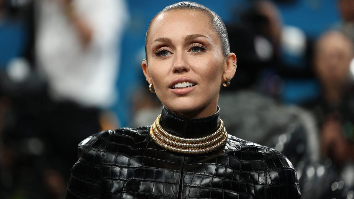 Miley Cyrus poses during the Met Gala, an annual fundraising gala held for the benefit of the Metropolitan Museum of Art's Costume Institute with this year's theme 'Superfine: Tailoring Black Style,' in New York City, New York, U.S., May 5, 2025. REUTERS/Mario Anzuoni