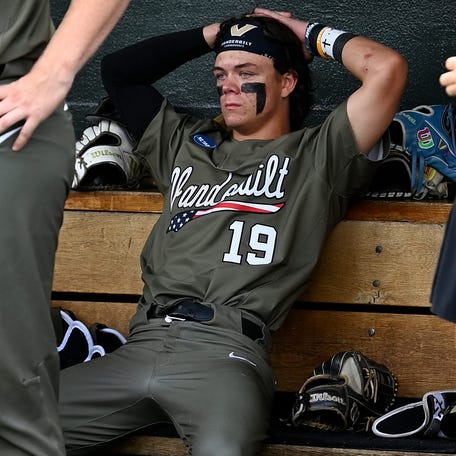 Vanderbilt infielder Rustan Rigdon (19) sits in the team's dugout after the Commodores were eliminated from the NCAA baseball tournament with a loss to Wright State in the Nashville Regional at Hawkins Field.