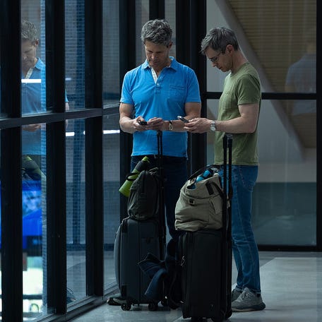 Passengers are seen looking at their devices at Northwest Florida Beaches International Airport in Panama City, Florida, on May 23, 2025. (Tyler Orsburn/News Herald)