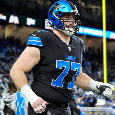 Detroit Lions center Frank Ragnow (77) warm up before the game between Detroit Lions and Buffalo Bills at Ford Field in Detroit on Sunday, Dec. 15, 2024.