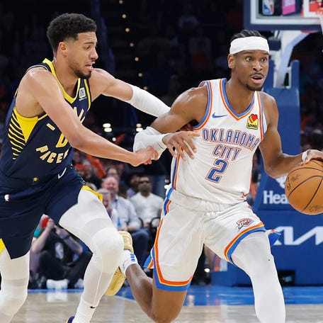 Thunder guard Shai Gilgeous-Alexander drives to the basket against Pacers guard Tyrese Haliburton during a March 29 regular-season matchup.