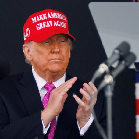 President Donald Trump wears a 'Make America Great Again' (MAGA) hat as he attends the commencement ceremony at West Point Military Academy in West Point, New York, on May 24, 2025.