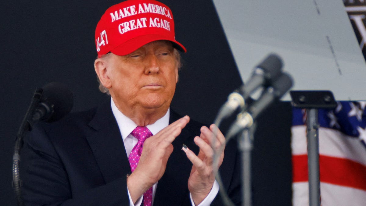 President Donald Trump wears a 'Make America Great Again' (MAGA) hat as he attends the commencement ceremony at West Point Military Academy in West Point, New York, on May 24, 2025.
