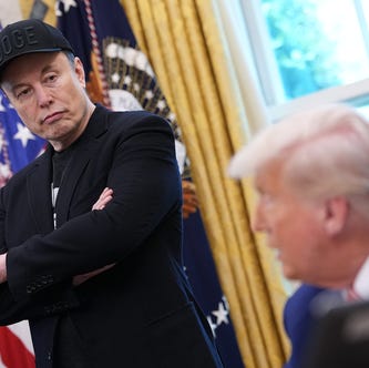 Tesla CEO Elon Musk listens as U.S. President Donald Trump speaks to reporters in the Oval Office of the White House on May 30, 2025 in Washington, DC.