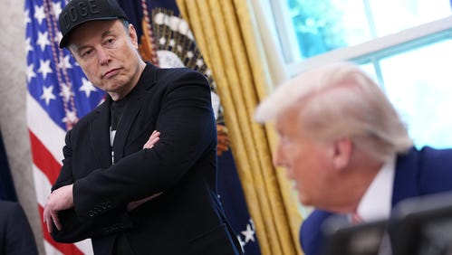 Tesla CEO Elon Musk listens as U.S. President Donald Trump speaks to reporters in the Oval Office of the White House on May 30, 2025 in Washington, DC.