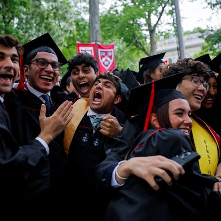 Undergraduate students react as they get their degree during the 374th Commencement exercises at Harvard University in Cambridge, Massachusetts, on May 29.