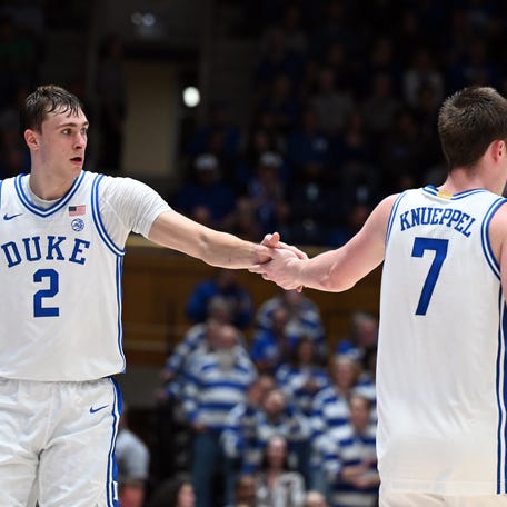 Duke Blue Devils forward Cooper Flagg (2) and forward Kon Knueppel (7) react during the second half against the George Mason Patriots at Cameron Indoor Stadium on Dec. 17, 2024.