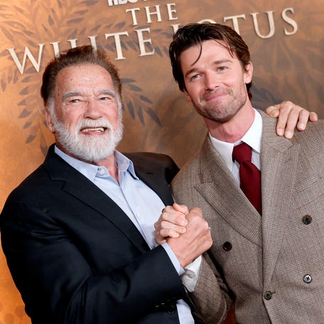 Arnold Schwarzenegger, left, and Patrick Schwarzenegger attend the Los Angeles premiere of "The White Lotus" Season 3 at Paramount Theatre on Feb. 10, 2025.