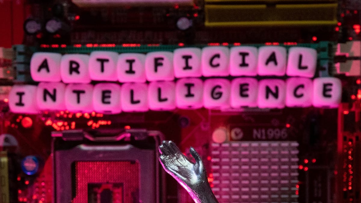 AI (Artificial Intelligence) letters and robot hand are placed on computer motherboard in this illustration. REUTERS/Dado Ruvic/Illustration