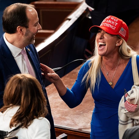 Marjorie Taylor Greene (R-Ga.) speaks with other Republican lawmakers after President Donald Trump addressed a joint session of Congress at the U.S. Capitol on Tuesday, March 4, 2025..