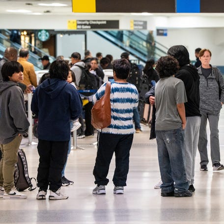 Passengers are shown in terminal C at Newark Liberty International Airport during the Memorial Day weekend, May 23, 2025.