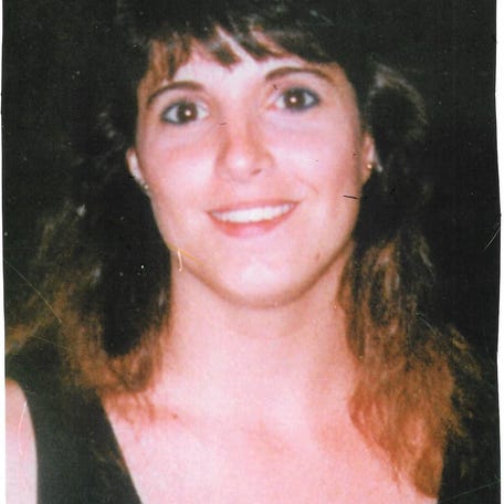 Carmen Gayheart is pictured before her murder at the age of 23. She left behind a husband, two children, both parents, a sister and a large extended family.