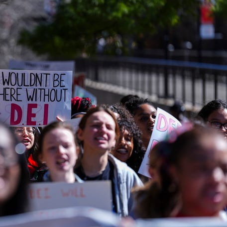 Students chanted and held signs during a rally to protect DEI in America Friday at the University of Louisville campus in Louisville, Kentucky on Feb. 28, 2025