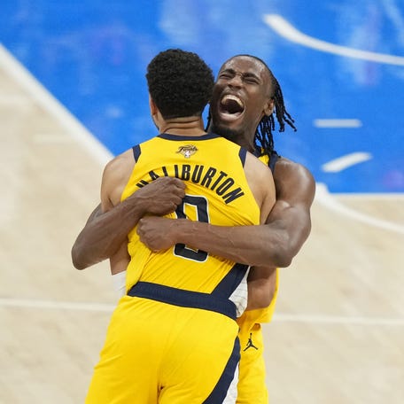 Indiana Pacers forward Aaron Nesmith (23) and guard Tyrese Haliburton (0) celebrate after a play against the Oklahoma City Thunder during the fourth quarter in Game 1 of the 2025 NBA Finals at Paycom Center in Oklahoma City, Oklahoma on June 5, 2025.