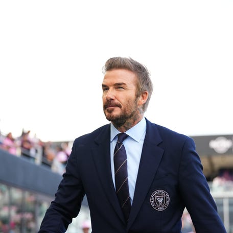 Inter Miami CF president and co-owner David Beckham walks onto the pitch prior to the first half against the New England Revolution at Chase Stadium.
