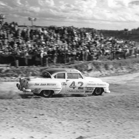 DAYTONA BEACH, FL - FEBRUARY 21, 1954: Lee Petty guides his Chrysler through a turn on his way to winning the NASCAR Cup race on the Daytona Beach-Road Course. Petty dominated the event, leading 37 of the 39 laps. (Photo by ISC Images & Archives via Getty Images)