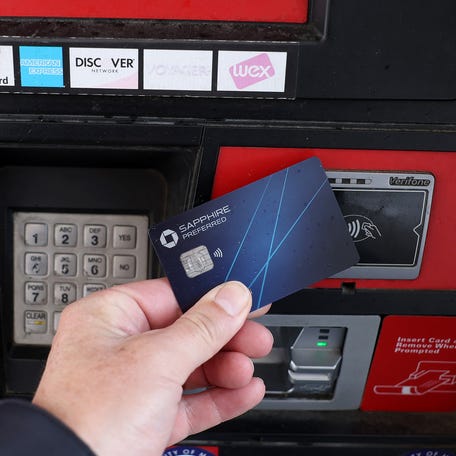 SAN ANSELMO, CALIFORNIA - FEBRUARY 07: In this photo illustration, a credit card is used to pay for gasoline on February 07, 2024 in San Anselmo, California.