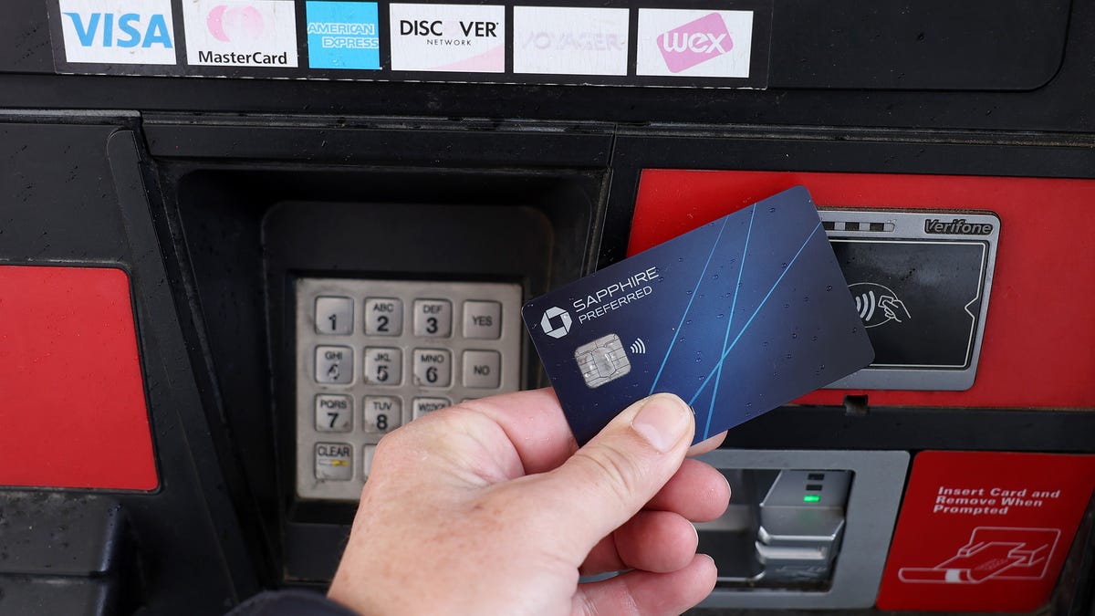 SAN ANSELMO, CALIFORNIA - FEBRUARY 07: In this photo illustration, a credit card is used to pay for gasoline on February 07, 2024 in San Anselmo, California.