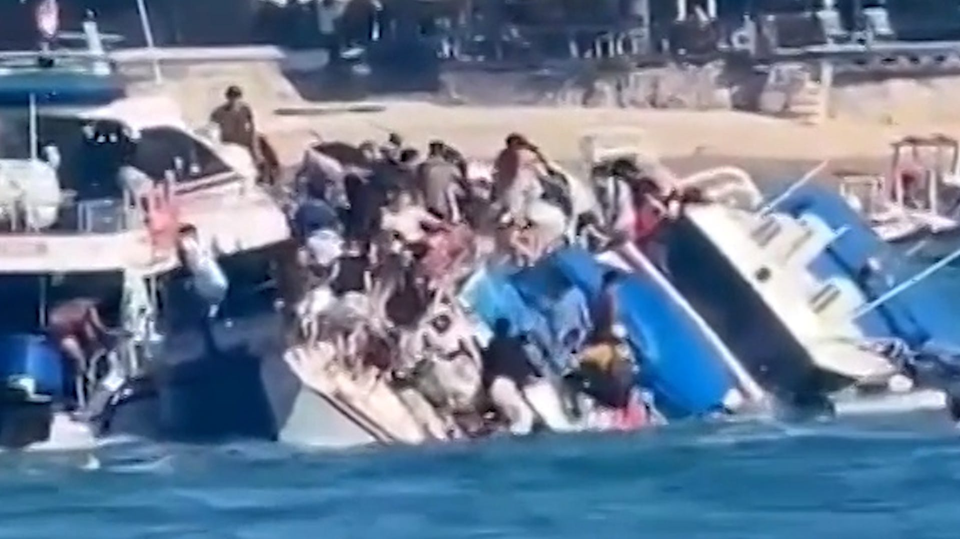 Watch as tourists scramble to escape capsized boat off the coast of Bali