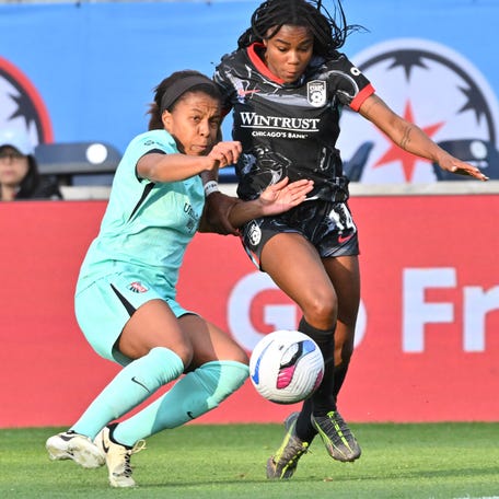 May 24, 2025; Bridgeview, Illinois, USA; Chicago Stars forward Ludmila (14) attempts to take a shot as Kansas City Current defender Elizabeth Ball (7) defends in the first half at SeatGeek Stadium. Mandatory Credit: Matt Cashore-Imagn Images
