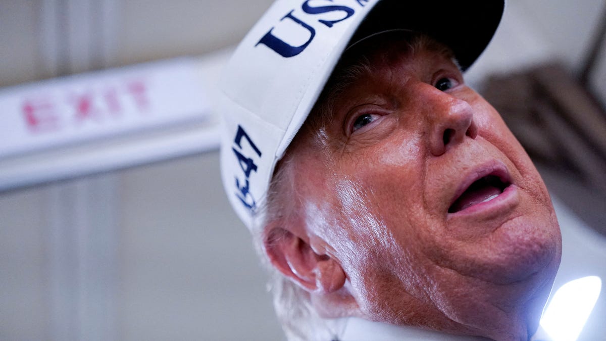 U.S. President Donald Trump speaks to reporters aboard Air Force One en route to New Jersey, U.S., June 6, 2025.