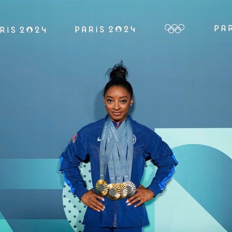 Aug 5, 2024; Paris, France; Simone Biles of the United States poses for a photo with her three gold and one silver medal after day three of the gymnastics event finals during the Paris 2024 Olympic Summer Games. Mandatory Credit: Kyle Terada-USA TODAY Sports